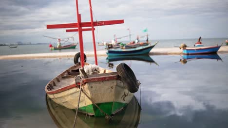 thailand's small traditional fishing boats floating above hua hin's historic fishing village