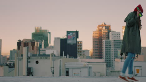 carefree-young-woman-walking-on-rooftop-at-sunset-drinking-alcohol-balancing-close-to-edge