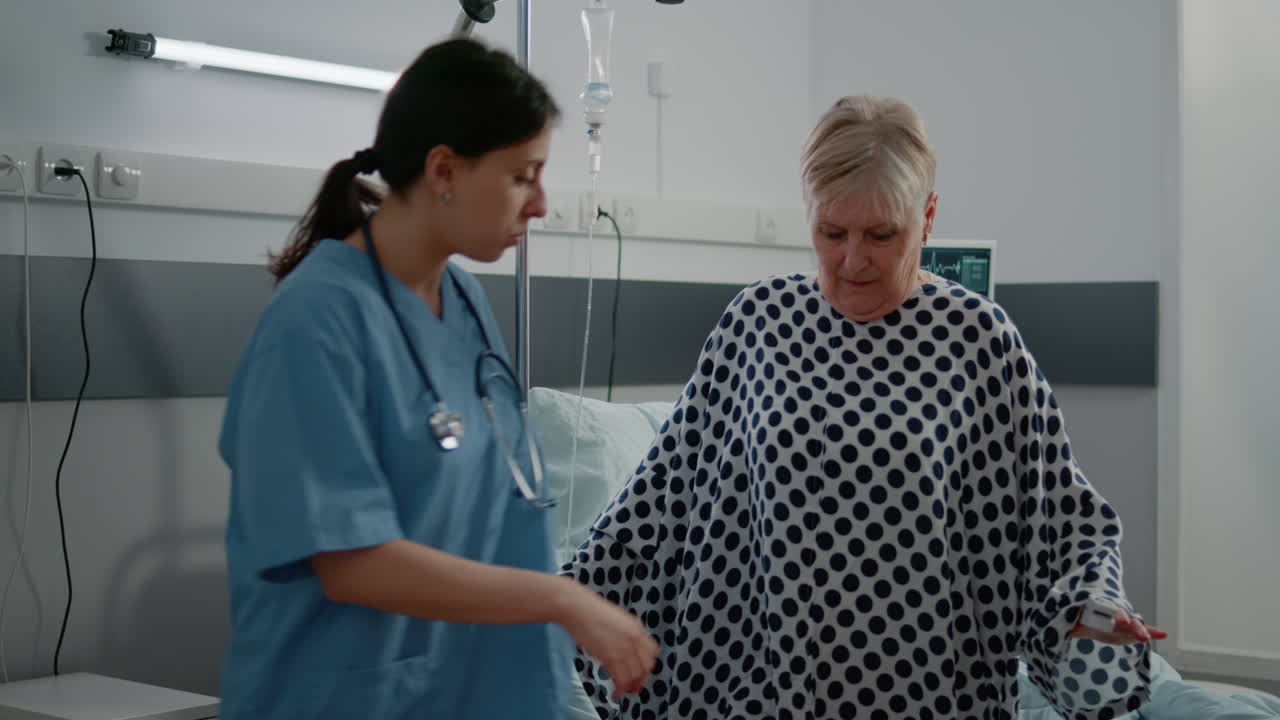 Woman working as nurse helping patient with sickness
