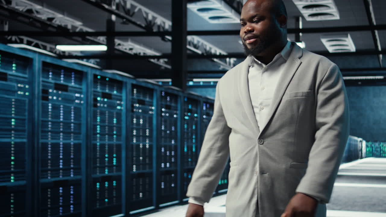 Vertical video Server farm admin overseeing supercomputers