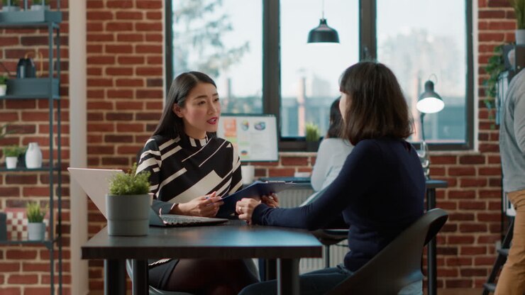 Candidate with resume attending job interview with HR recruiter