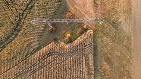 high voltage tower with electric power lines transfening electrical energy through cable wires