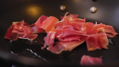 fried ham in a pan close-up