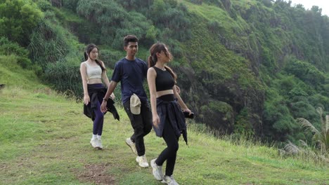 friends hiking and dancing in nature