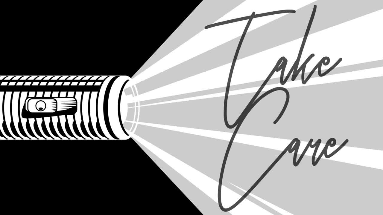 la linterna ilumina el texto de cuidado. la lámpara eléctrica de bolsillo de la mano.