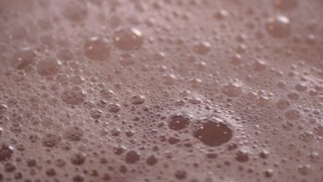 pink frothy bubbles in water