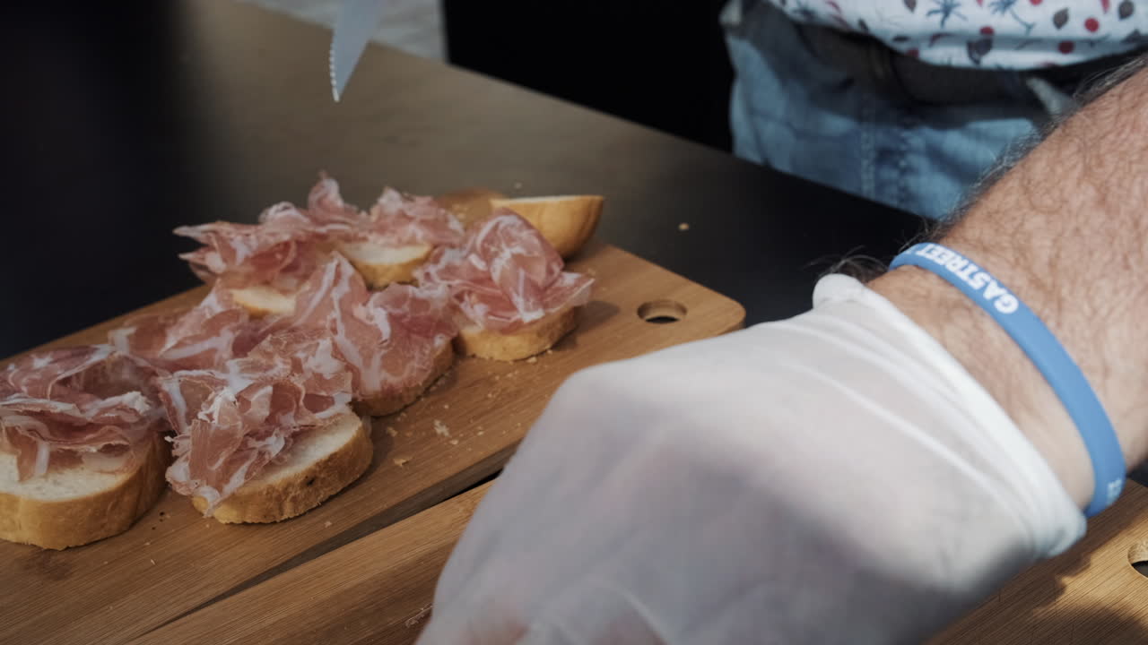 Preparing Prosciutto and Bread Appetizers