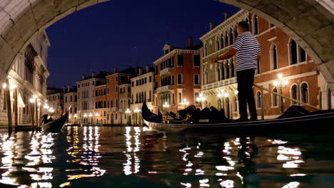 venice canal at night with gondolas