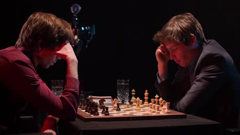 two men locked in intense ranked chess match plan their next moves in timed tournament