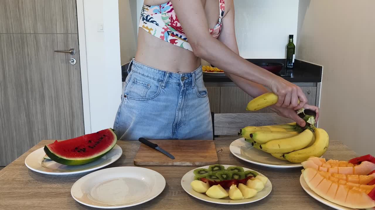 Woman preparing fruit in the kitchen