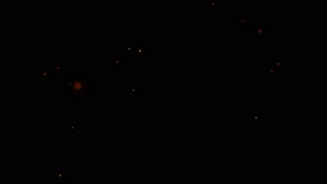 shiny particles flying on dark background