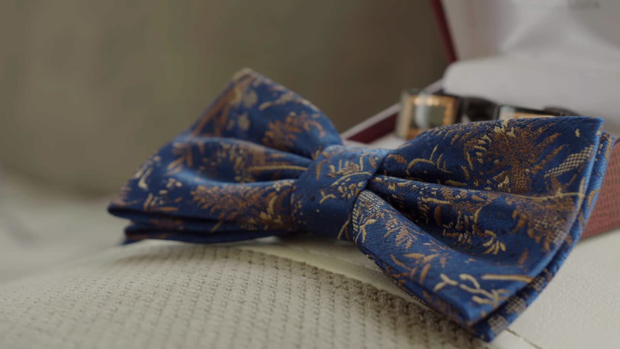 Close-up of the blue wedding bow tie, waiting for the groom's preparations