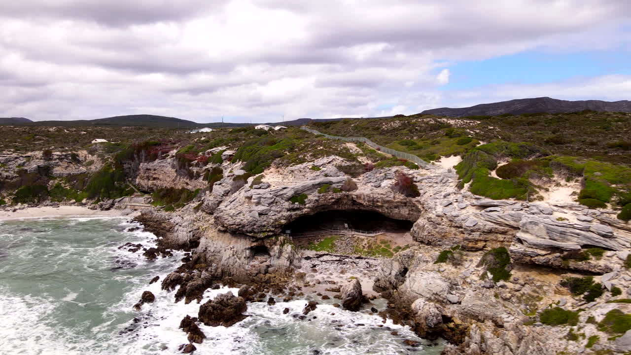 Historical Klipgat Cave along scenic limestone rich Walker Bay Reserve, aerial