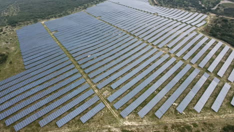 flying over a large-scale photovoltaic system. solar park in france cloudy day