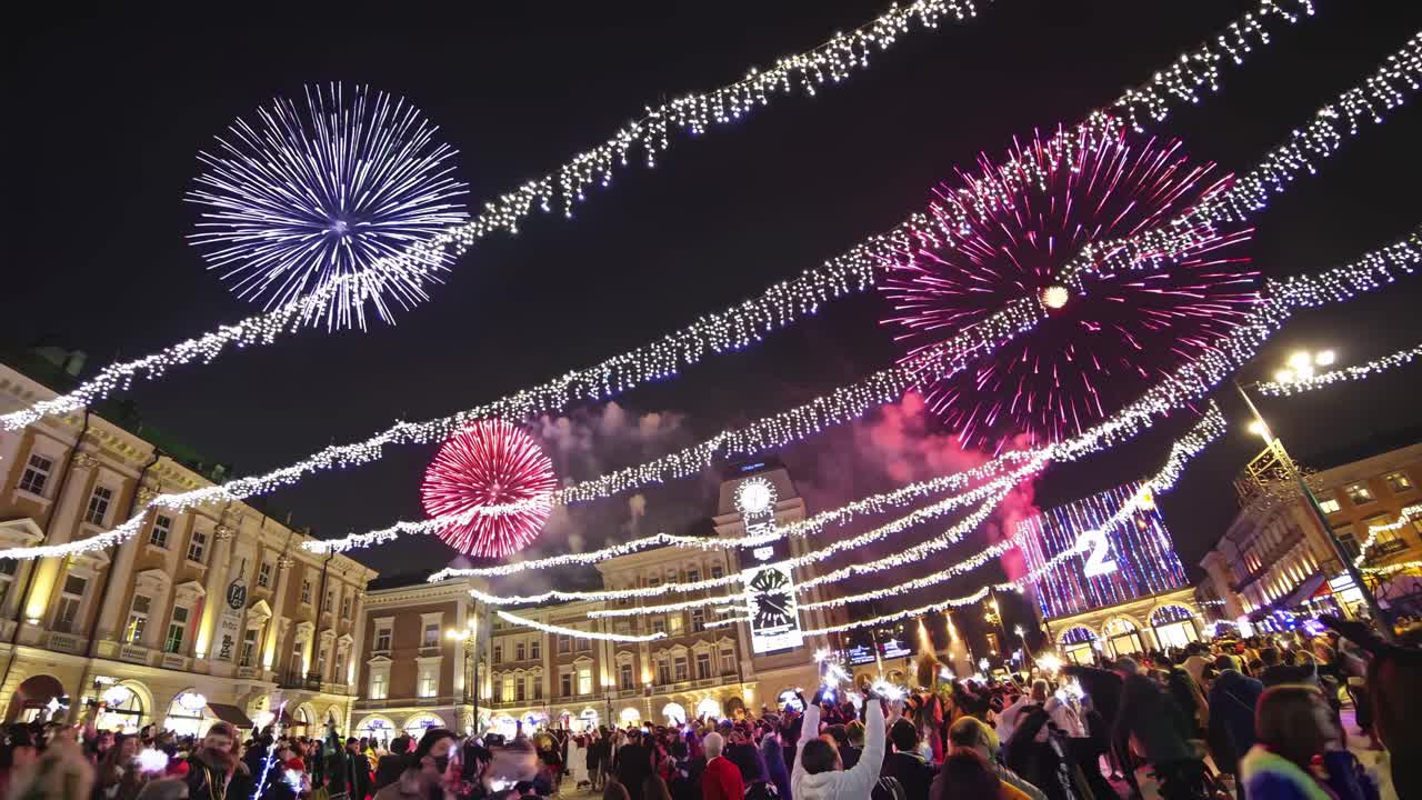 Fireworks celebration in a city at night