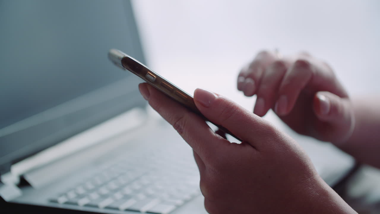 Close-up of Hands Tapping and Scrolling on a Smartphone