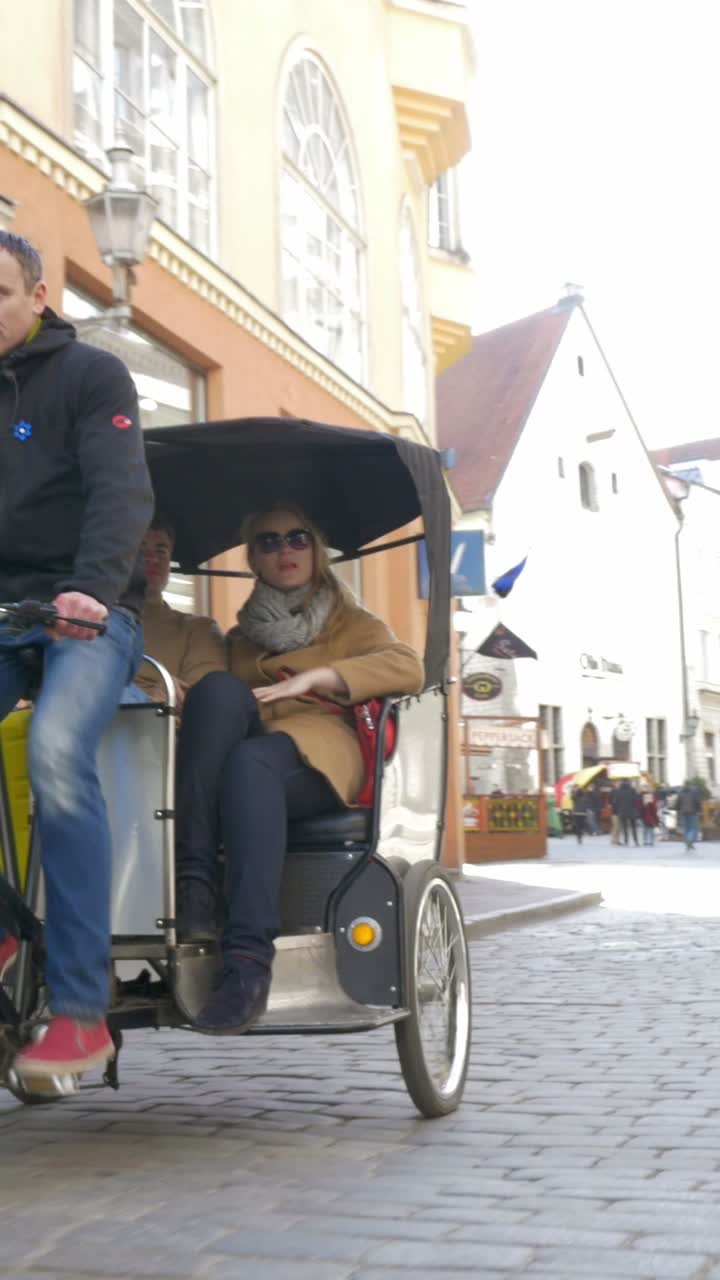 People Riding a Tricycle