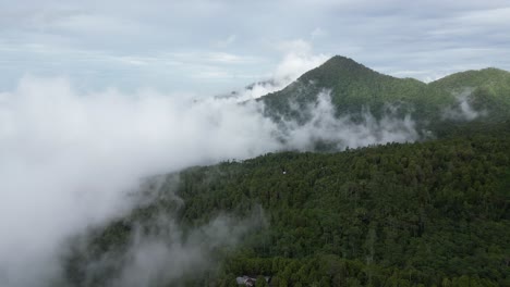 Low-clouds-slowly-moving-over-hills-and-mountains-in-the-North-of-Bali,-Indonesia