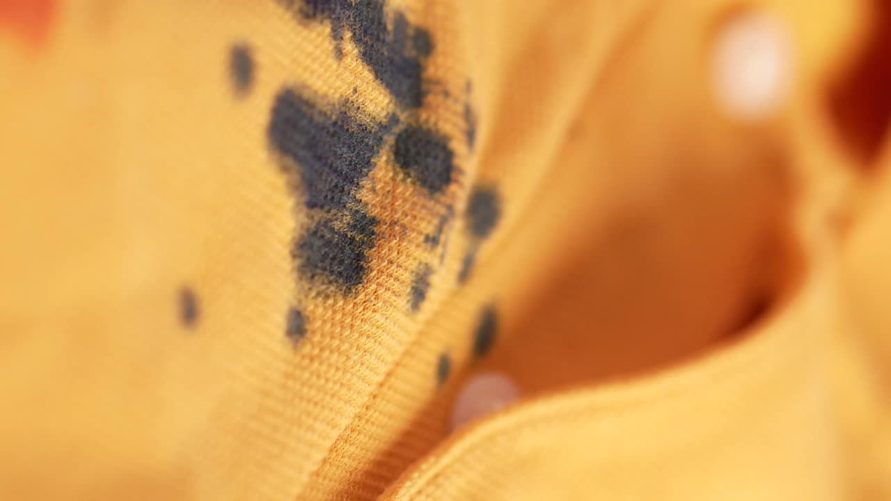 Close-up of stained yellow fabric