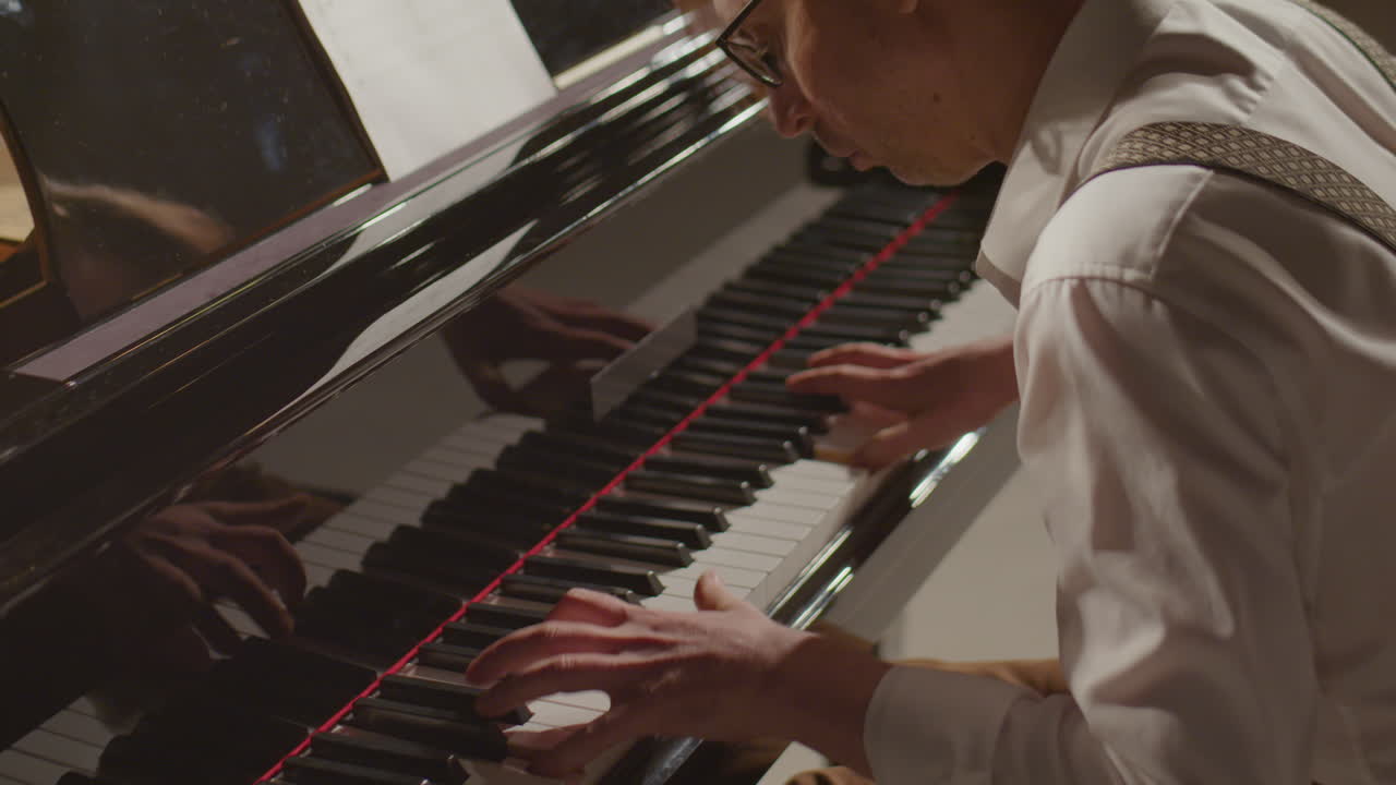 Pianist Enjoying Playing Music on Stage