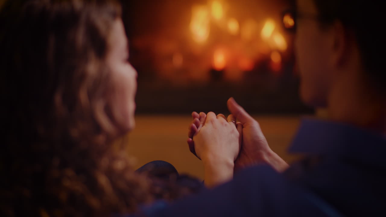 Couple enjoying a cozy evening by the fireplace