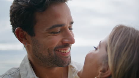 happy lovers flirting together seaside terrace closeup. smiling macho man date