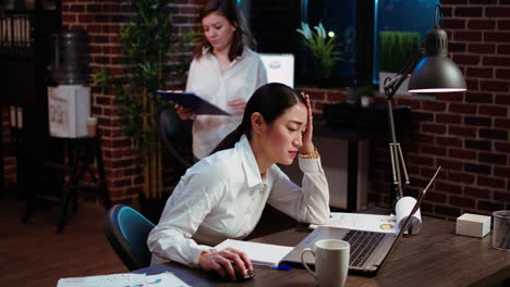 worker squinting eyes in exasperation, feeling overworked