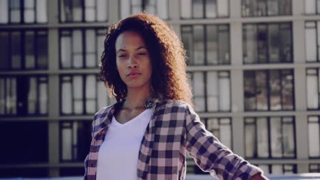 Fashionable-young-woman-on-urban-rooftop