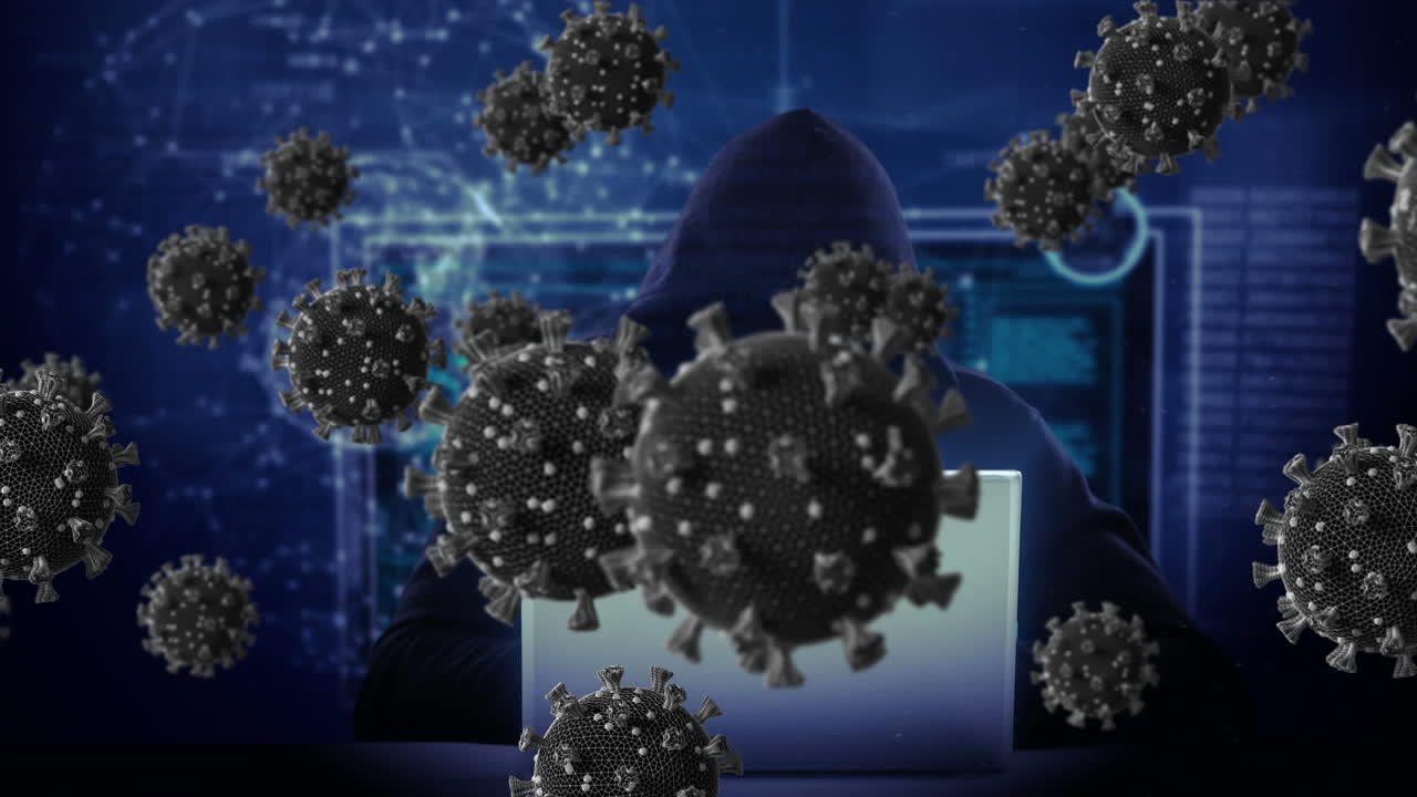 animación de células macro covid19 sobre un hombre con capucha, usando una computadora portátil