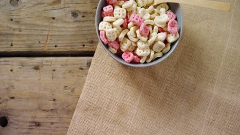 bowl of honeycomb cereal with spoon 4k