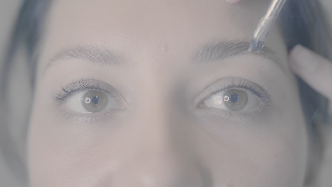 Woman getting eyebrow treatment