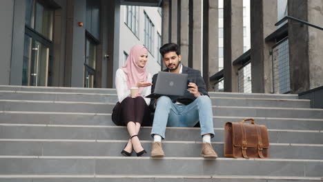 business couple discussing on stairs