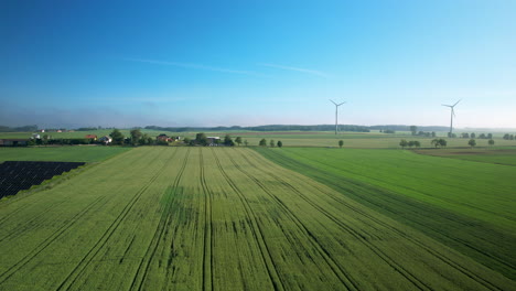 Solar-panels-and-windmills-on-a-small-farm-town