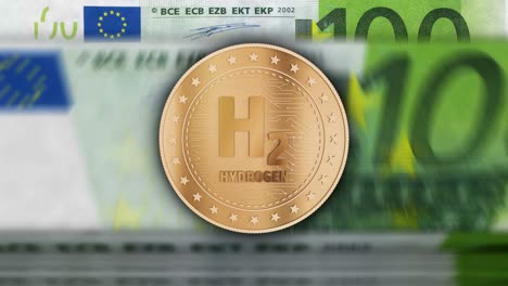 h2 monedas de oro de hidrógeno sobre el bucle de billetes de euro