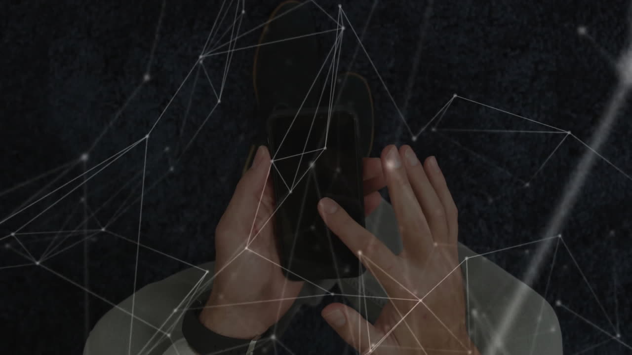 Man holding smartphone on dark carpet wearing fitness band, showing technology network mesh overlay