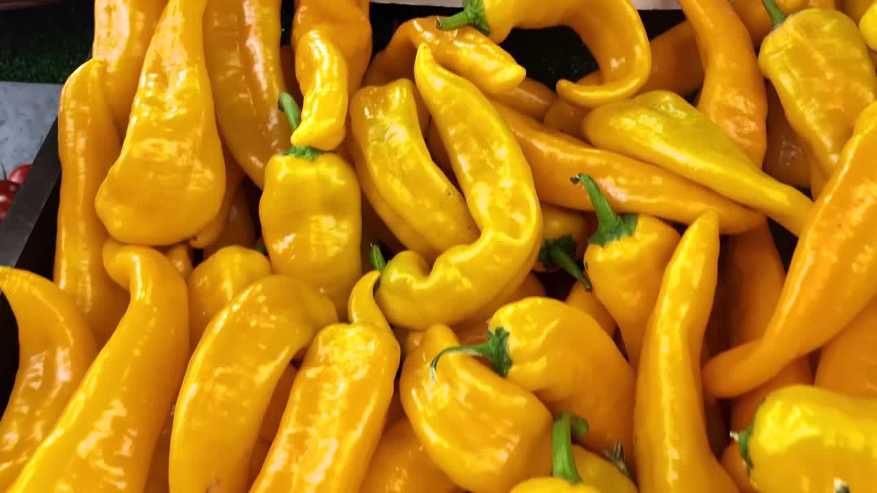 Selection of Colorful Peppers at a Market