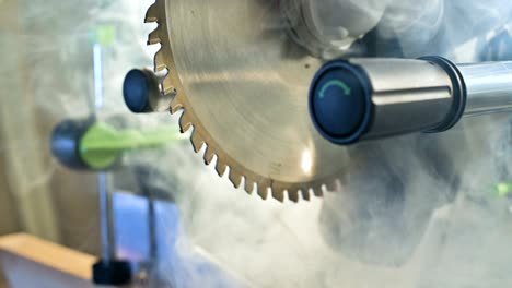 close-up machine circular saw in wood in smoke.