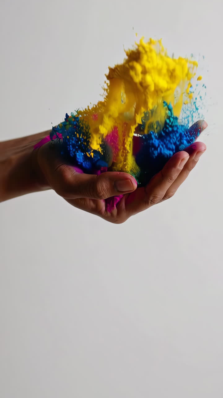 Colorful Powder Exploding from a Hand