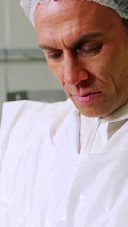 butcher using digital tablet
