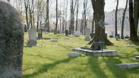 Zoom-In-Of-A-Graveyard-With-Tombstones-In-An-Urban-Area-On-A-Sunny-Day-4