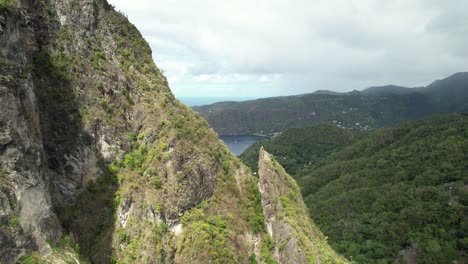 close proximity pass by petit piton, revealing soufriere bay, in saint lucia