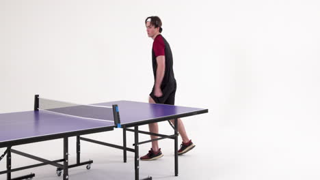 playing table tennis, man in sportswear preparing for next serve