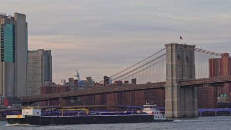 iconic view of manhattan with east river and skyscrapers