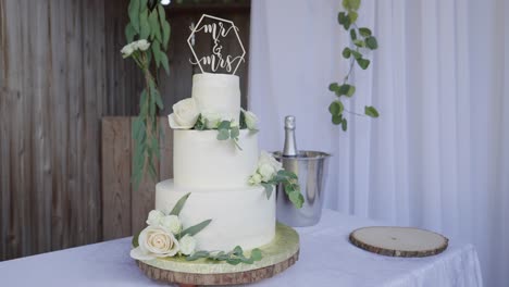 delicious three-story wedding cake with cake topper