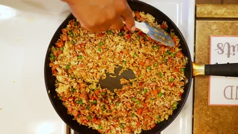 Stirring-the-rice-ham-and-vegetables-before-adding