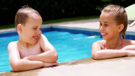 Sibling-enjoying-in-swimming-pool