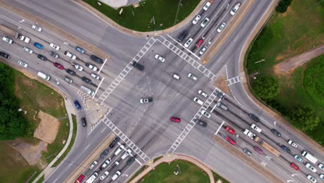 drone hyperlapse of heavy traffic in a intersection - static, top down, time lapse shot