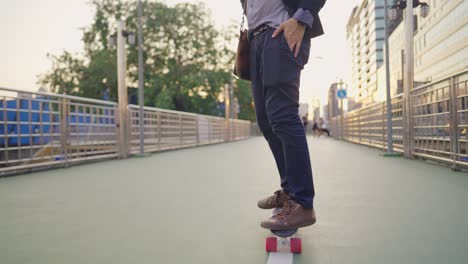 young adult working man in business attire suit, get on the skateboard transportation to work office, urban city lifestyle avoid from crowded traffic jam, morning sun light, modern active lifestyle