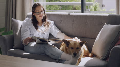 Tranquil-woman-and-her-dog-relaxing-on-a-couch