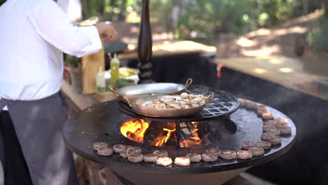 grilled squid on skewers in a frying pan.